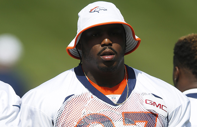 Denver Broncos defensive end Malik Jackson warms up during the NFL football team's voluntary veterans minicamp Tuesday, April 28, 2015, in Englewood, Colo. (AP Photo/David Zalubowski)